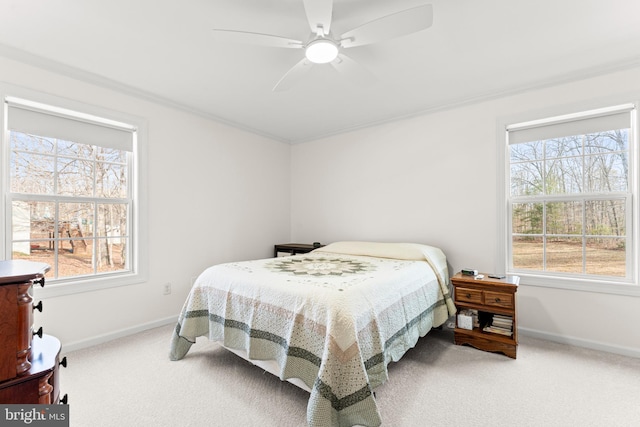 bedroom featuring multiple windows, carpet floors, and baseboards