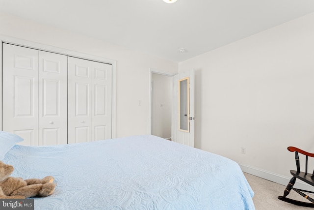 bedroom featuring a closet and baseboards