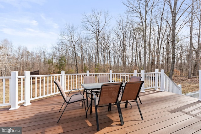 deck with outdoor dining space