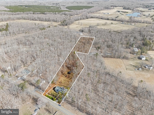 birds eye view of property featuring a rural view