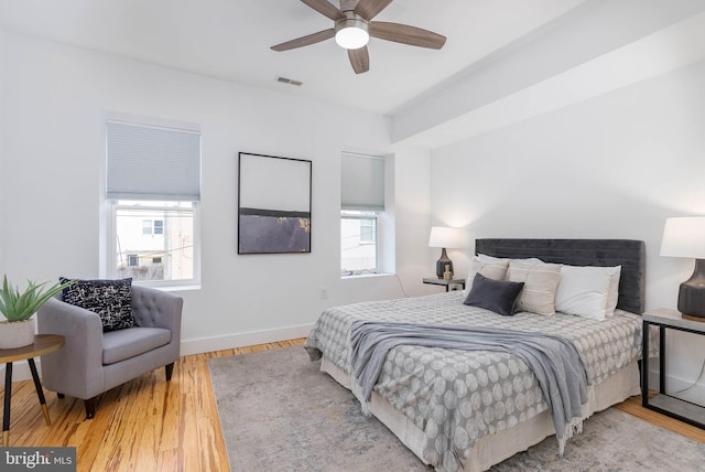 bedroom with ceiling fan and hardwood / wood-style floors