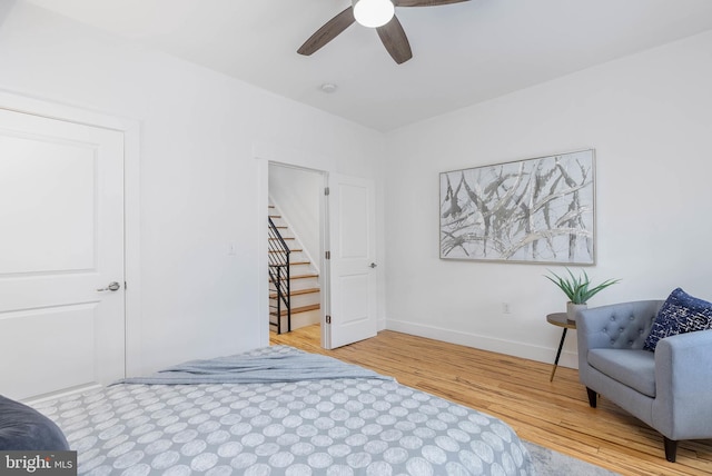 bedroom with hardwood / wood-style flooring and ceiling fan