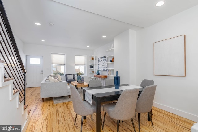 dining area with light hardwood / wood-style floors