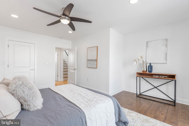 bedroom with dark wood-type flooring and ceiling fan