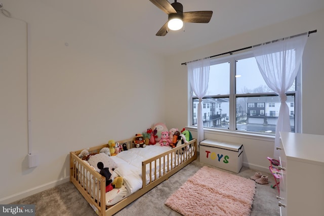 bedroom with light colored carpet and ceiling fan