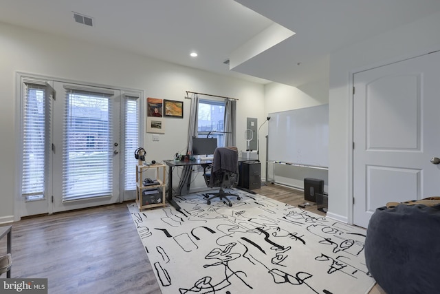 office space with light wood-type flooring