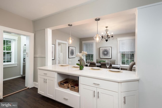 bathroom with wood finished floors, a wealth of natural light, and baseboards