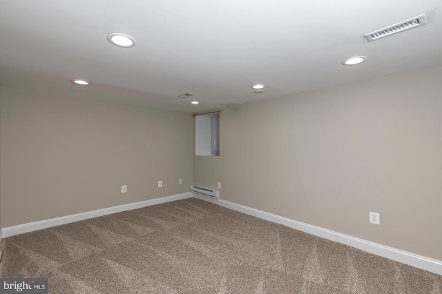 carpeted spare room featuring recessed lighting, baseboards, visible vents, and baseboard heating