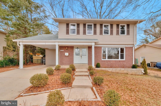 view of front of property featuring a carport