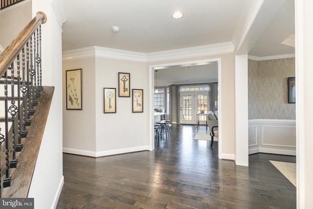 entryway featuring crown molding, dark wood-type flooring, and french doors