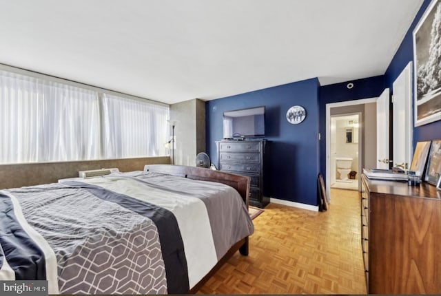 bedroom featuring light parquet floors