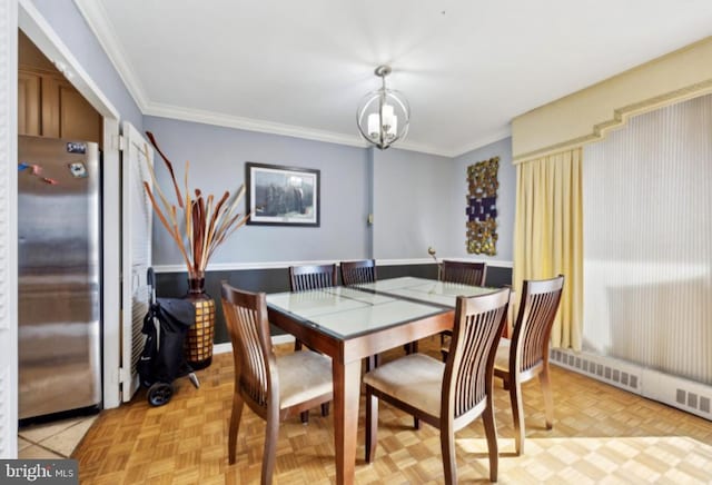 dining area featuring an inviting chandelier, light parquet flooring, and ornamental molding