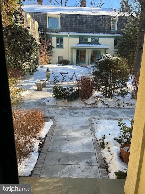 view of snow covered house