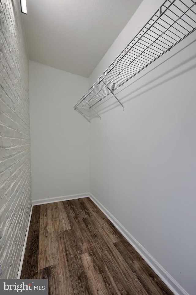 spacious closet with wood finished floors