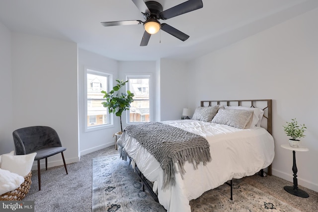 bedroom featuring a ceiling fan, carpet, and baseboards