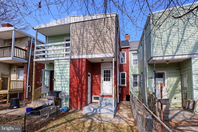 view of front of house with brick siding