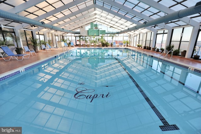 view of swimming pool with a lanai