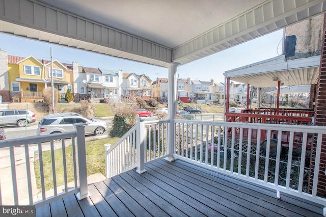 wooden deck featuring a residential view