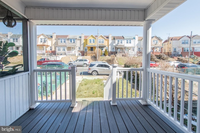 wooden terrace with a residential view