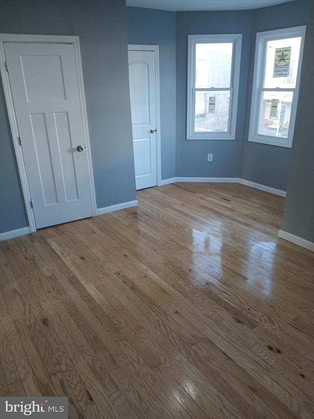 unfurnished bedroom with light hardwood / wood-style floors