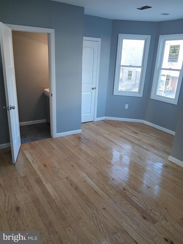 unfurnished bedroom featuring light hardwood / wood-style flooring