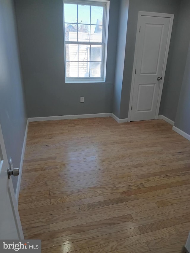 unfurnished room featuring light hardwood / wood-style floors