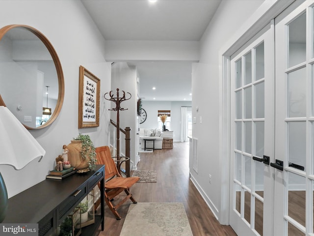 hall with dark wood-type flooring