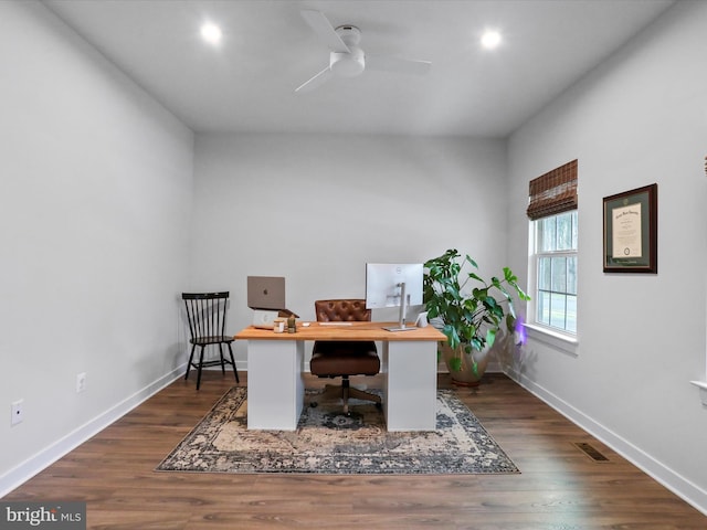 office space with dark wood-type flooring and ceiling fan