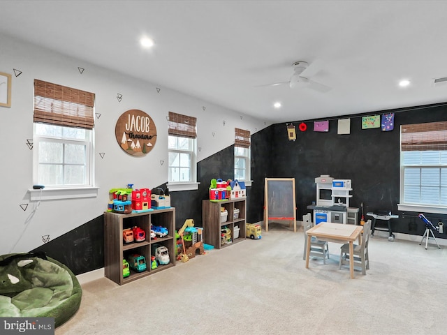 recreation room featuring carpet and ceiling fan