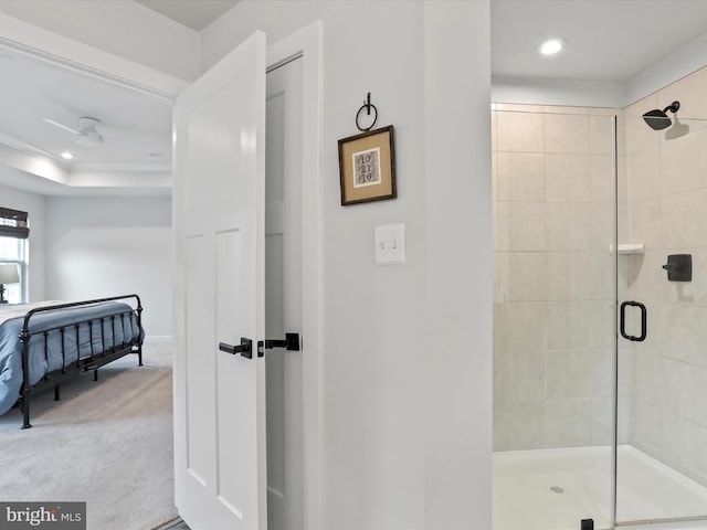 bathroom with a shower with shower door