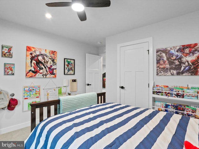 bedroom with ceiling fan and light carpet