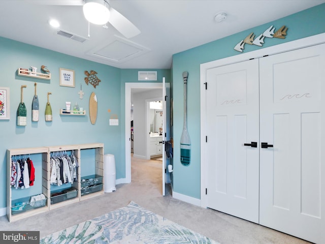 bedroom with ceiling fan and light colored carpet