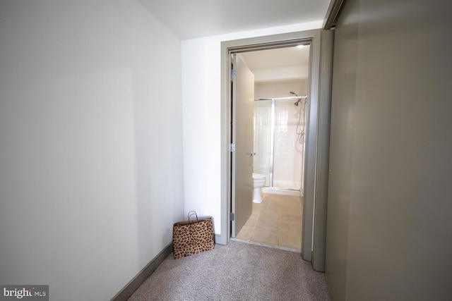 hallway with light colored carpet