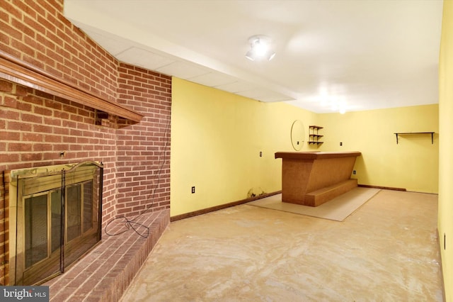 unfurnished living room with a brick fireplace