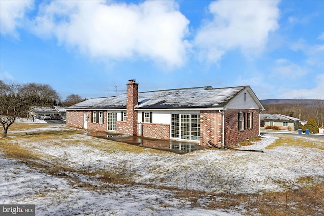 view of snow covered house