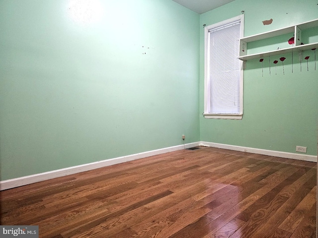 empty room featuring hardwood / wood-style floors