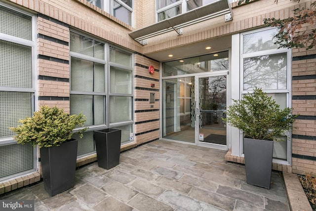 entrance to property with a patio