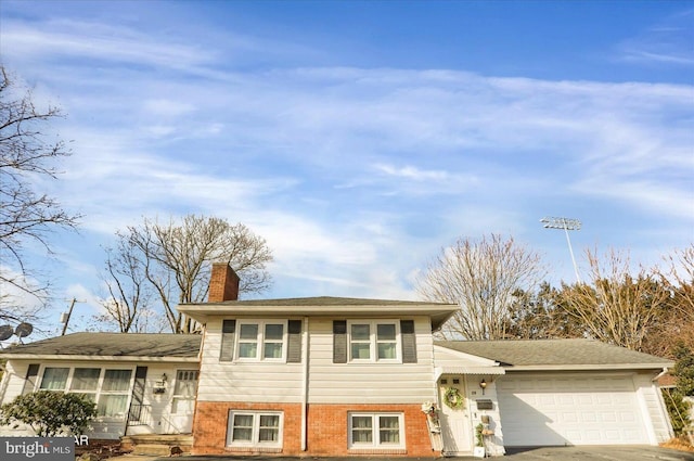 split level home with a garage