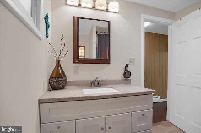 bathroom featuring vanity and a baseboard heating unit