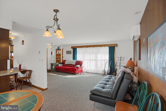 living room with light carpet, a notable chandelier, a wall unit AC, and wood walls