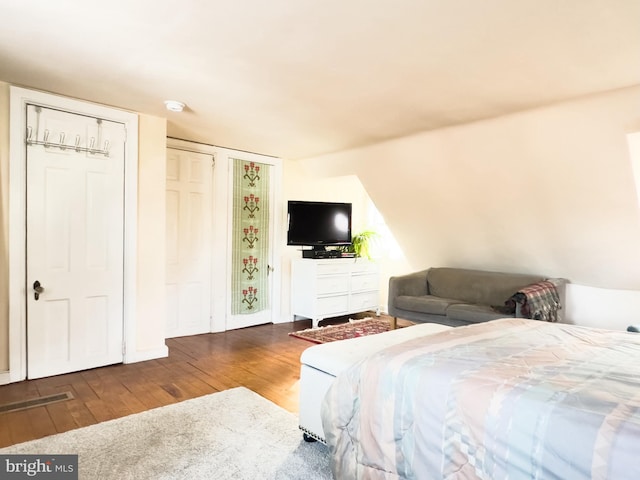 bedroom with wood-type flooring