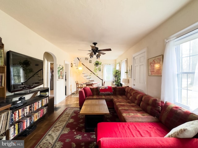 living room with ceiling fan and hardwood / wood-style floors