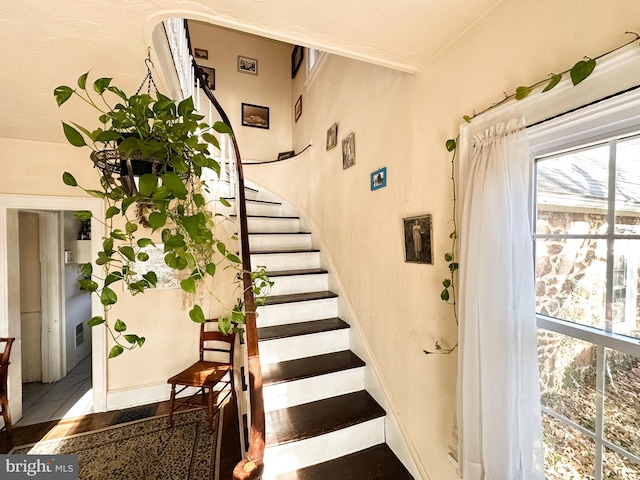 staircase with tile patterned flooring