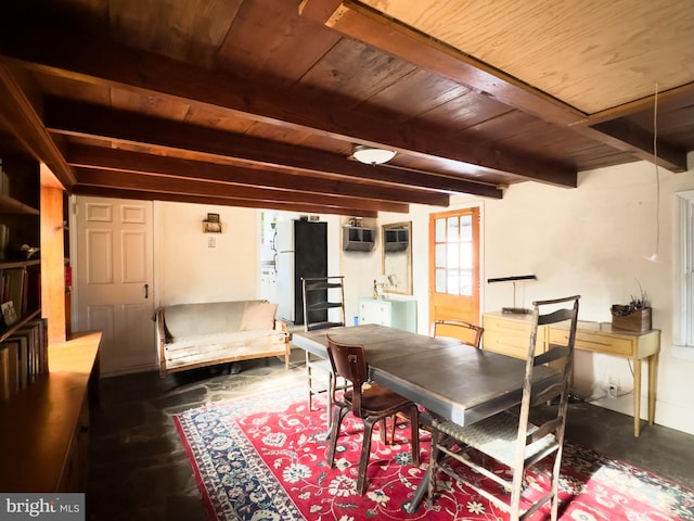 dining room with wood ceiling, concrete floors, and beamed ceiling