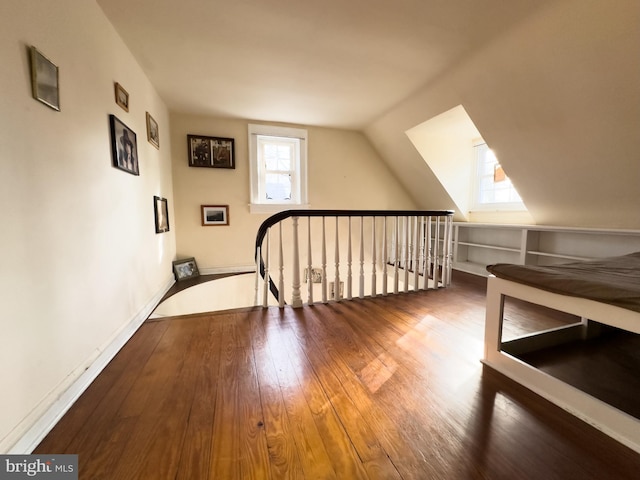 bonus room featuring hardwood / wood-style floors and vaulted ceiling