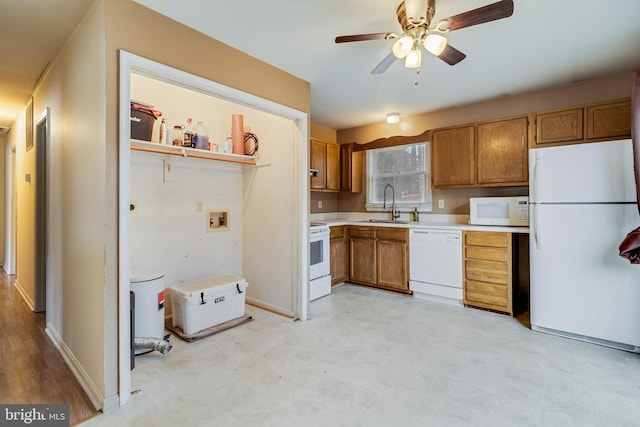 kitchen with ceiling fan, sink, and white appliances