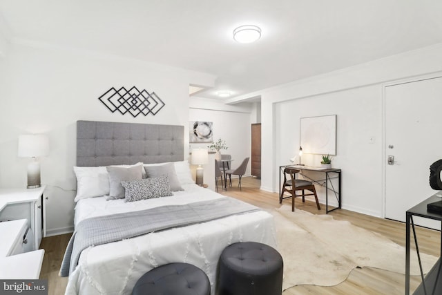 bedroom with hardwood / wood-style floors