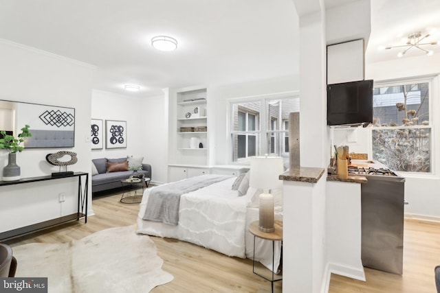 bedroom with ornamental molding and light wood-type flooring