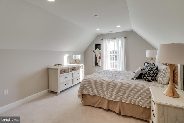 carpeted bedroom featuring vaulted ceiling