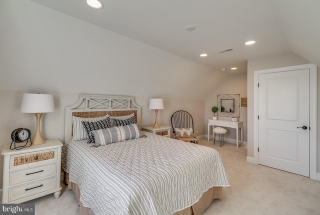 bedroom with light carpet and vaulted ceiling